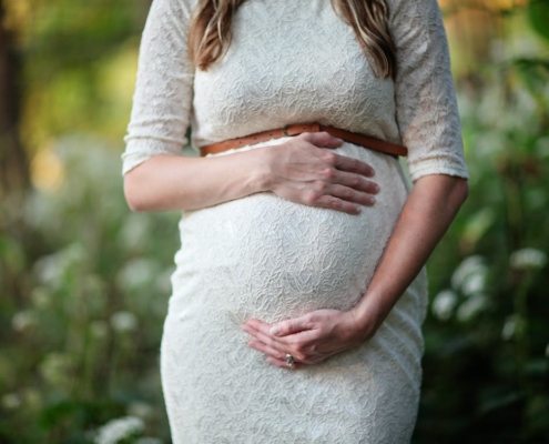 A pregnant woman holding her belly